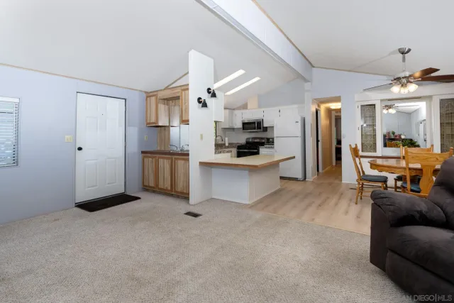 a kitchen with stainless steel appliances a refrigerator stove microwave and sink