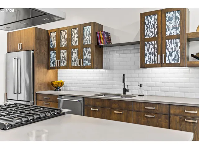 a spacious bedroom with a bed and a wall painting