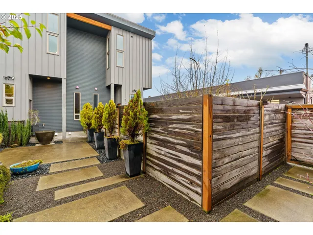 a view of a house with a door and a bench