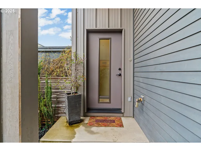 a view of front door with wooden floor