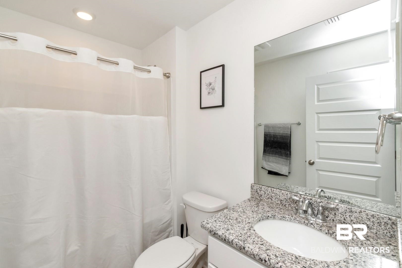 10921 Northern Dancer Court Daphne, AL 36526 - Photo 25 of 32 Bathroom featuring vanity, walk in shower, and toilet