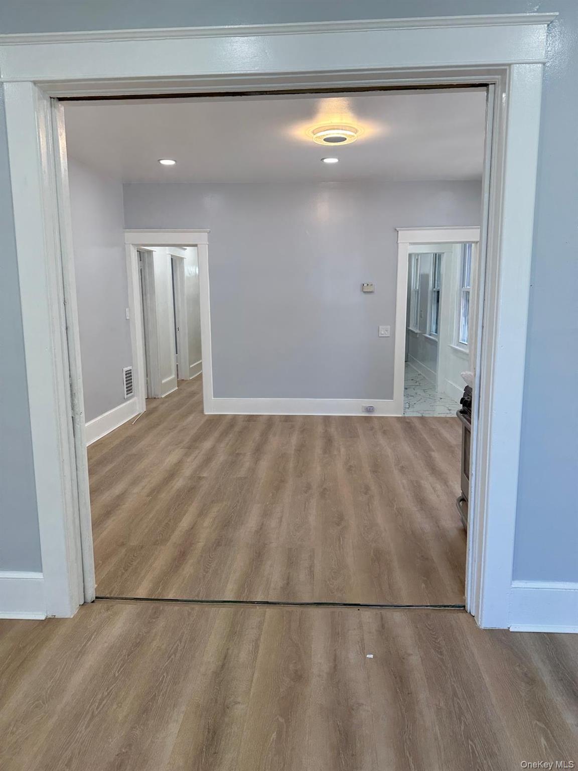 15 Forbus Street Poughkeepsie, NY 12601 - Photo 8 of 9 a view of a big room with wooden floor and cabinet