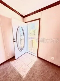 a view of a room with drop and furniture