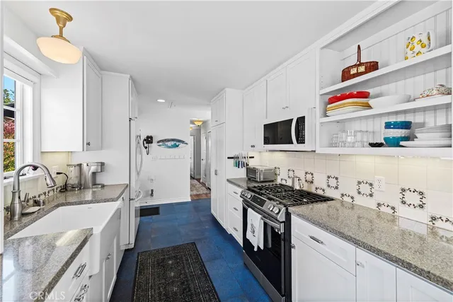 a kitchen with granite countertop lots of counter top space
