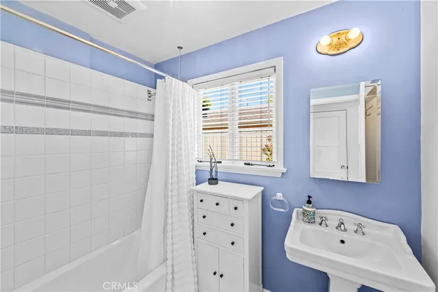 a bathroom with a sink a toilet and a bathtub