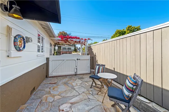 a view of a chairs and table in patio