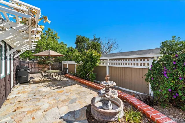 a view of an outdoor sitting area with furniture