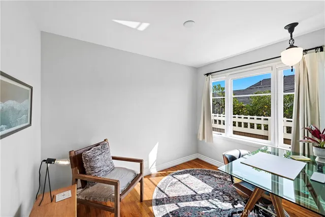 a bedroom with furniture and a window