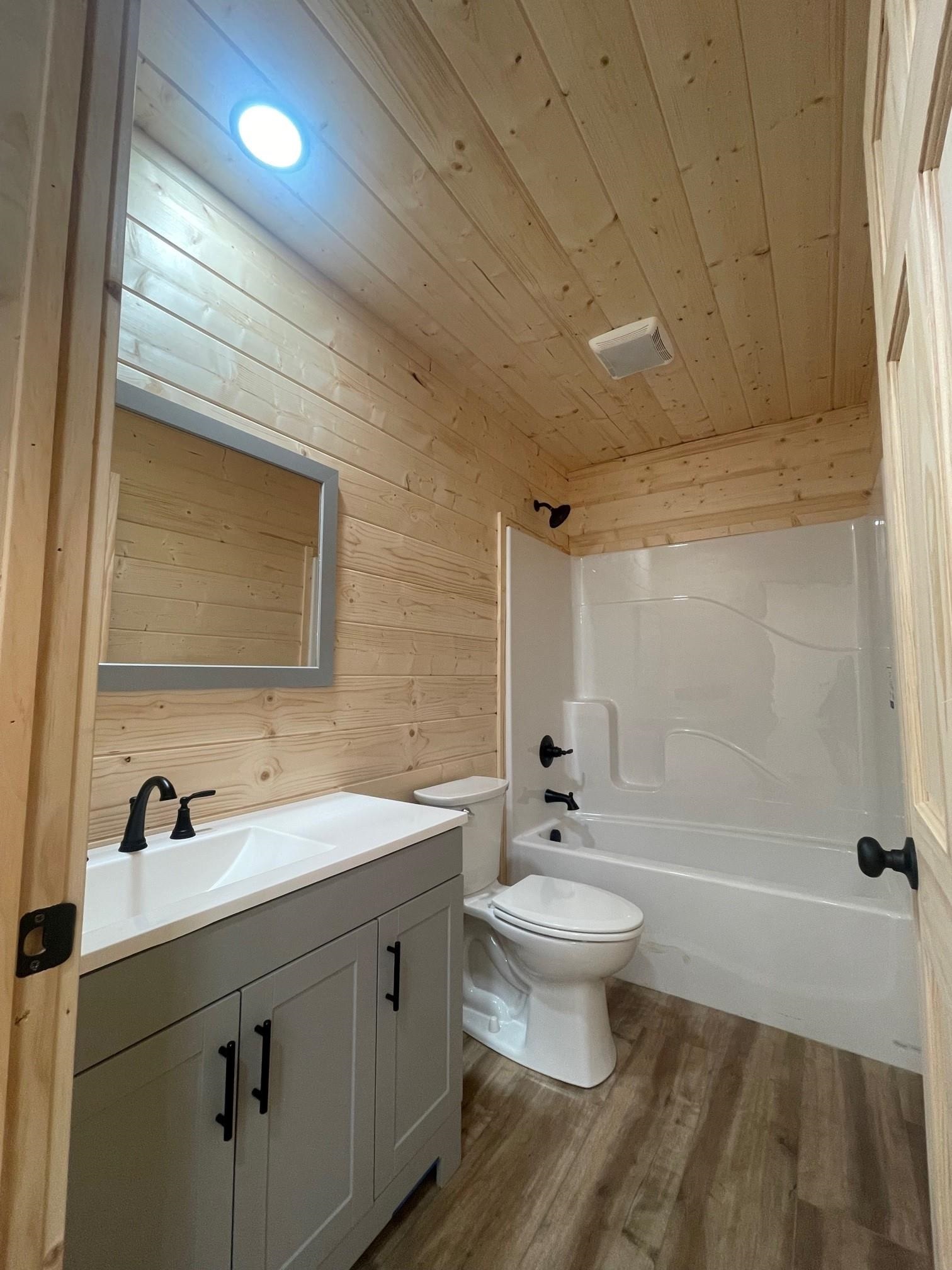 60 Trout Pass Mathias, WV 26812 - Photo 14 of 46 a bathroom with a sink a toilet and shower