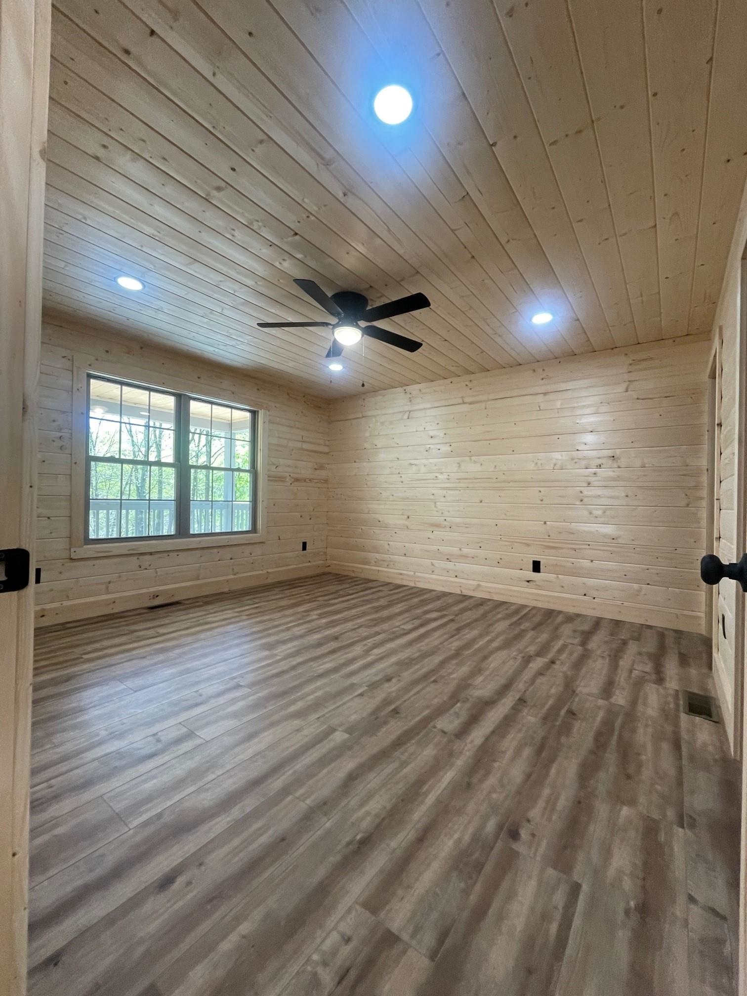 60 Trout Pass Mathias, WV 26812 - Photo 25 of 46 an empty room with wooden floor and windows
