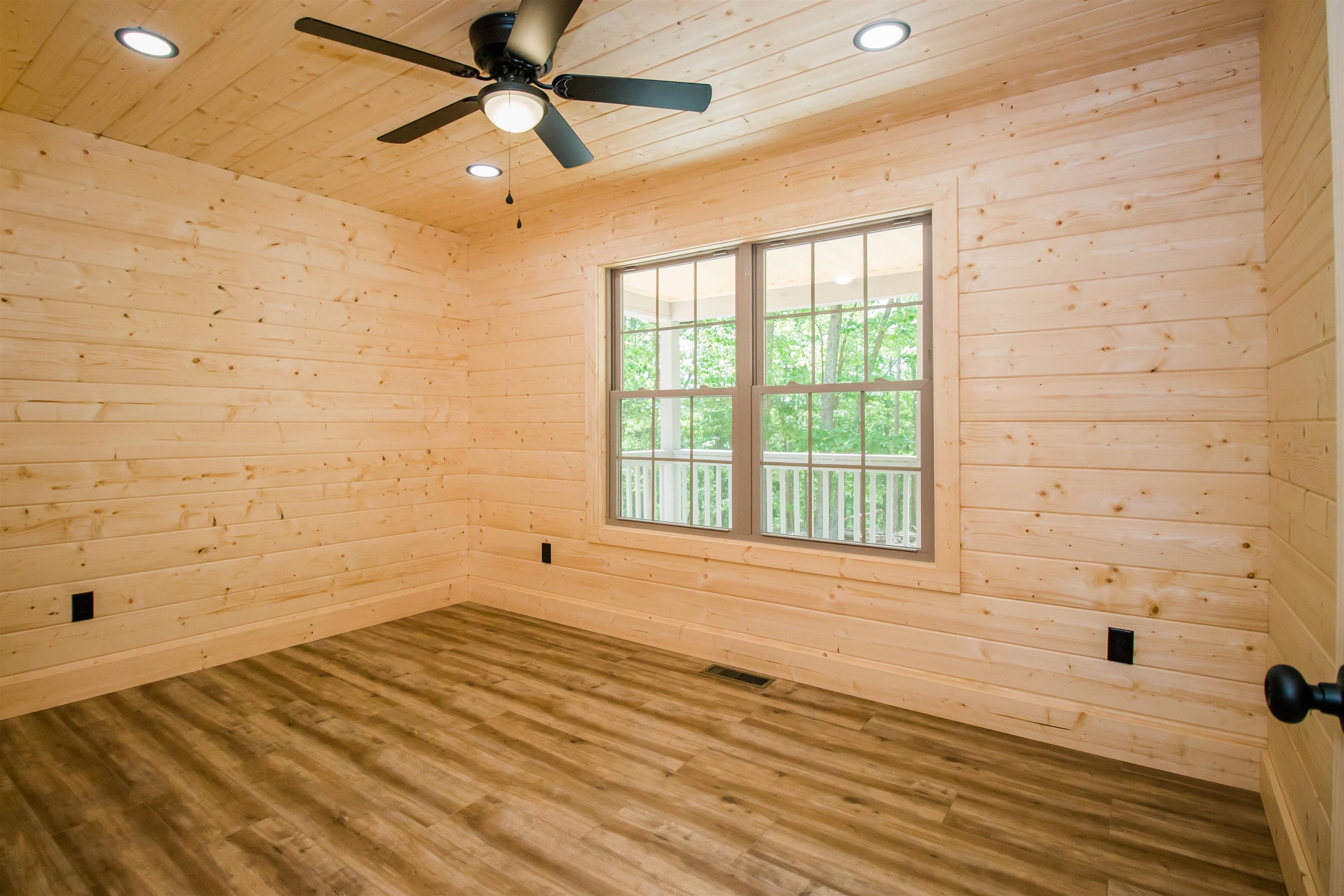 60 Trout Pass Mathias, WV 26812 - Photo 28 of 46 a view of an empty room with a window and a ceiling fan