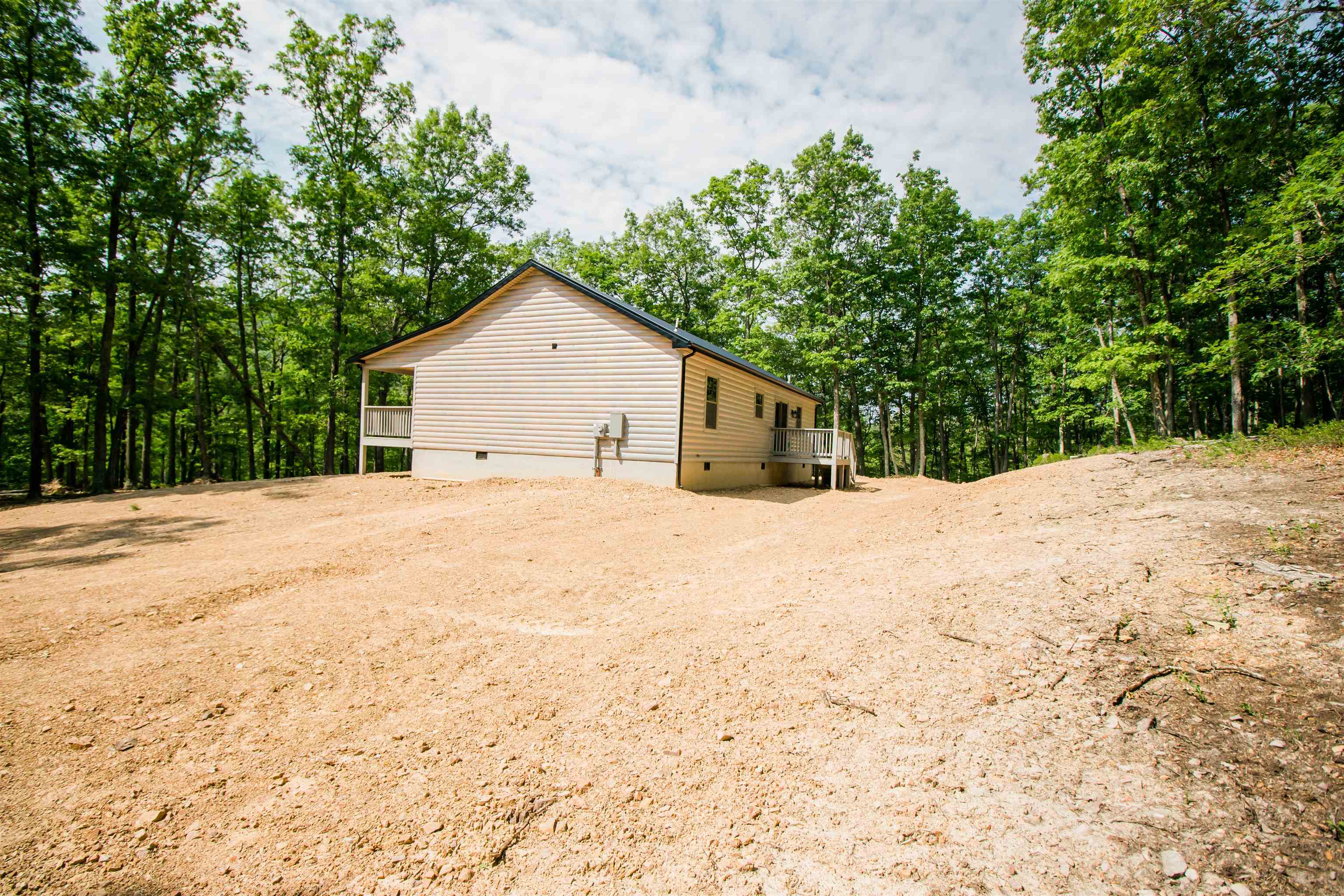 60 Trout Pass Mathias, WV 26812 - Photo 45 of 46 a view of house with yard and trees in the background