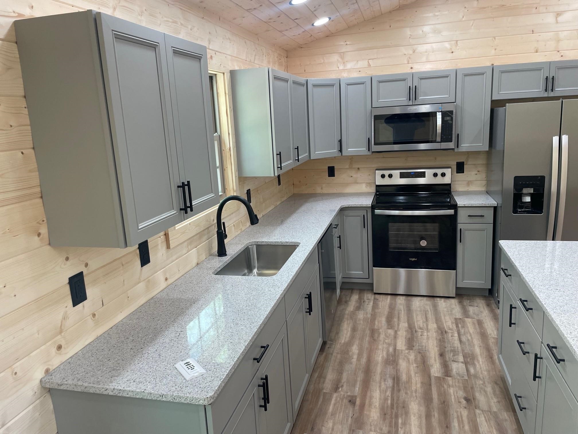 60 Trout Pass Mathias, WV 26812 - Photo 9 of 46 a kitchen with stainless steel appliances a sink stove and refrigerator