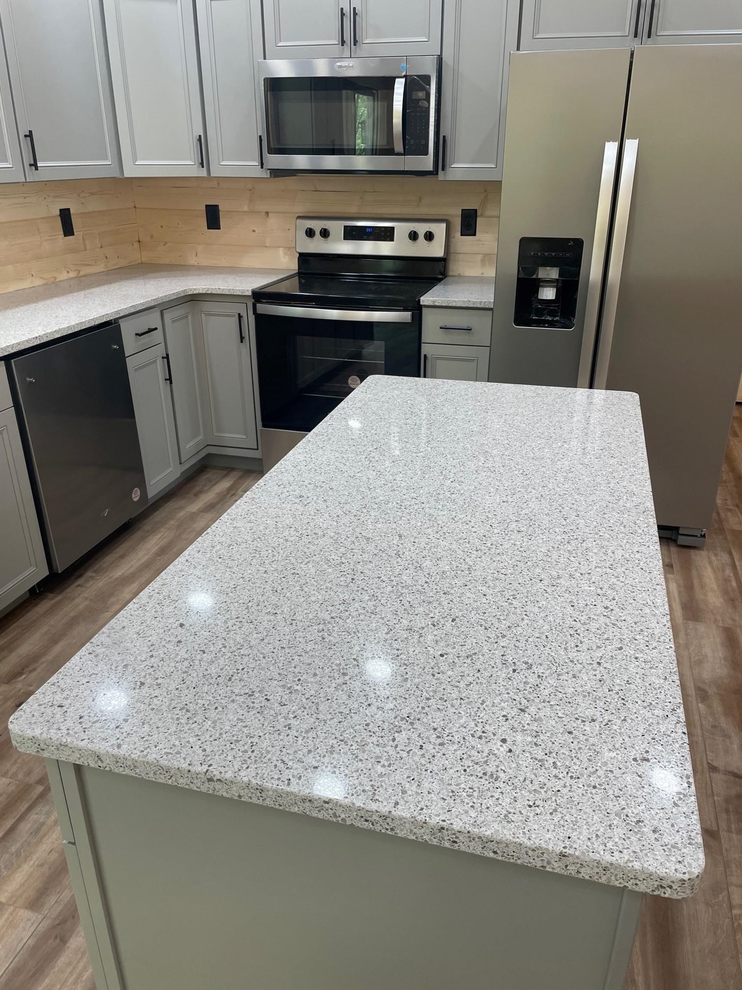 60 Trout Pass Mathias, WV 26812 - Photo 10 of 46 a kitchen with stainless steel appliances granite countertop a sink a stove and a microwave