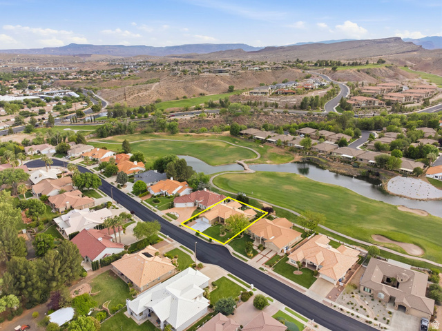 1985 West Rivers Edge Lane St. George, UT 84770 - Photo 7 of 42 Aerial view of property's location featuring a water and mountain view, nearby suburban area, and property parcel outlined