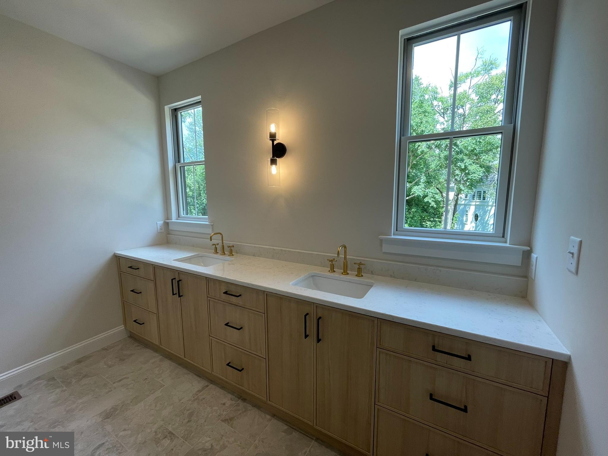 723 B Saylors Mill Road Spring City, PA 19475 - Photo 19 of 25 a bathroom with a double vanity sink and a window