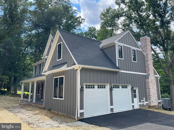 a front view of a house with a garage