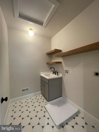 a bathroom with a toilet a window and a shower