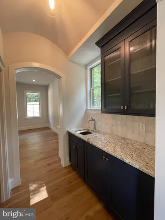 a bathroom with a glass door shower