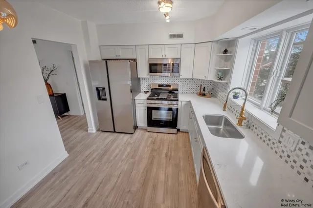 a bathroom with a sink mirror toilet and bathtub