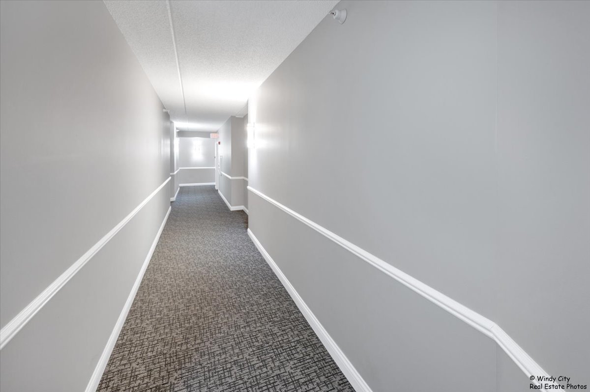 455 West Front Street, Unit 2208 Wheaton, IL 60187 - Photo 5 of 20 a view of hallway with stairs