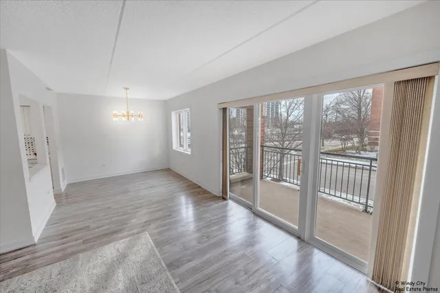 a spacious bathroom with a double vanity sink a mirror and a bathtub