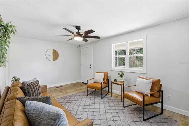 a living room with furniture and a window