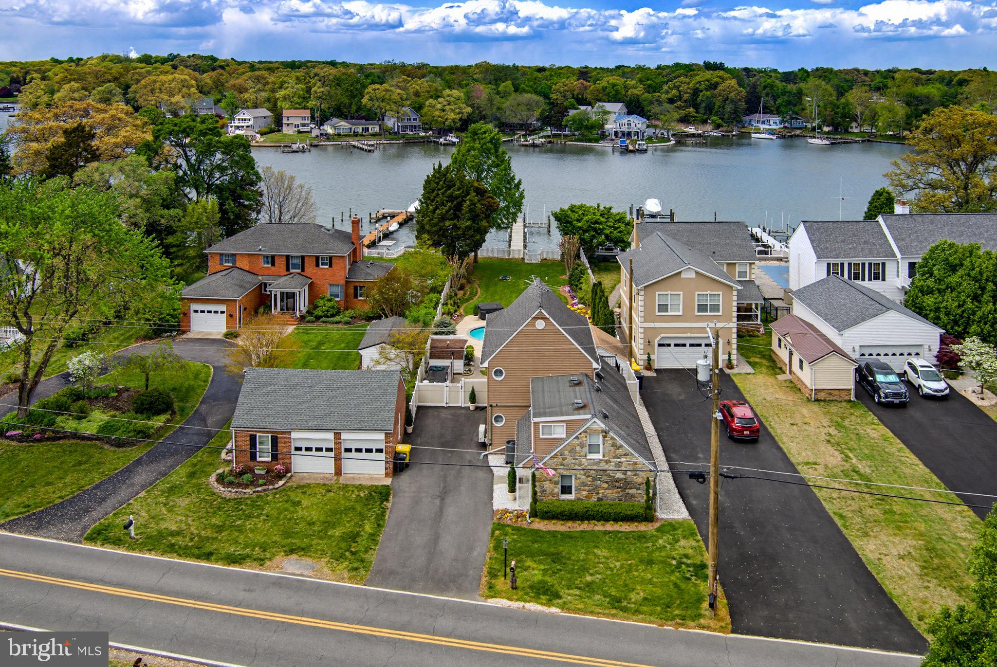 2006 Poplar Ridge Road Pasadena, MD 21122 - Photo 55 of 69 an aerial view of a house with pool lake view and mountain view