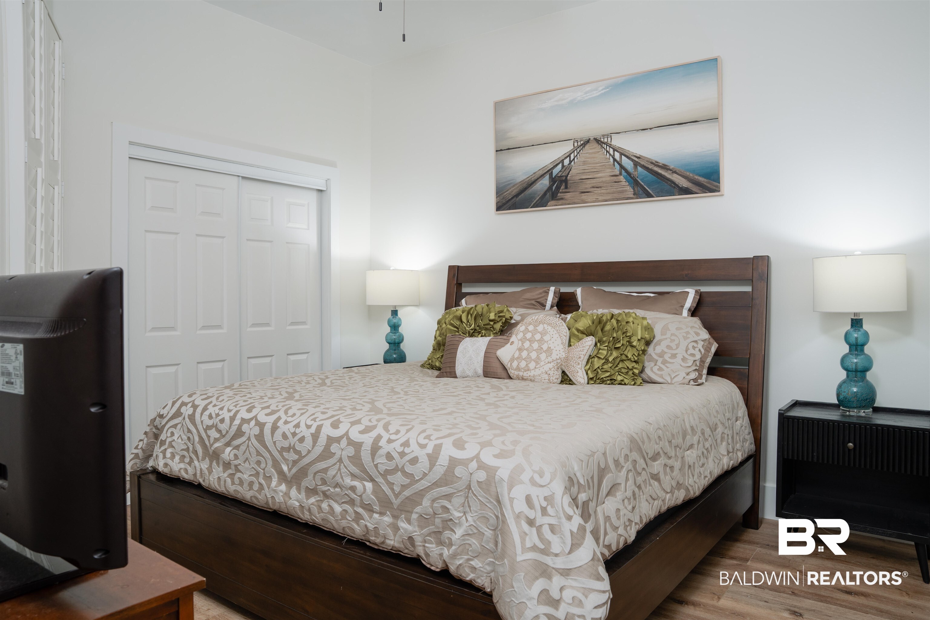 28107 Perdido Beach Boulevard, Unit DPH05 Orange Beach, AL 36561 - Photo 14 of 43 Bedroom featuring light wood-type flooring and a closet