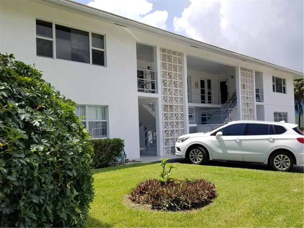 3208 Colony Club Road, Unit 6 Pompano Beach, FL 33062 - Photo 1 of 21 a house view with a garden space