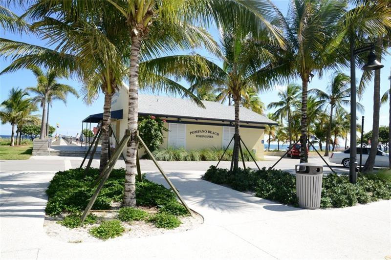 3208 Colony Club Road, Unit 6 Pompano Beach, FL 33062 - Photo 21 of 21 a park with palm trees
