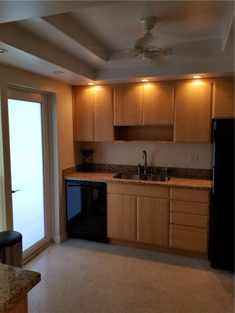 3208 Colony Club Road, Unit 6 Pompano Beach, FL 33062 - Photo 3 of 21 a kitchen with granite countertop a sink and a stove top oven