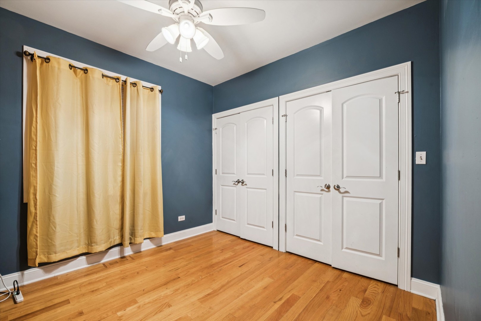 641 East 50th Street, Unit 1 Chicago, IL 60615 - Photo 11 of 15 a view of an empty room with window and hardwood floor