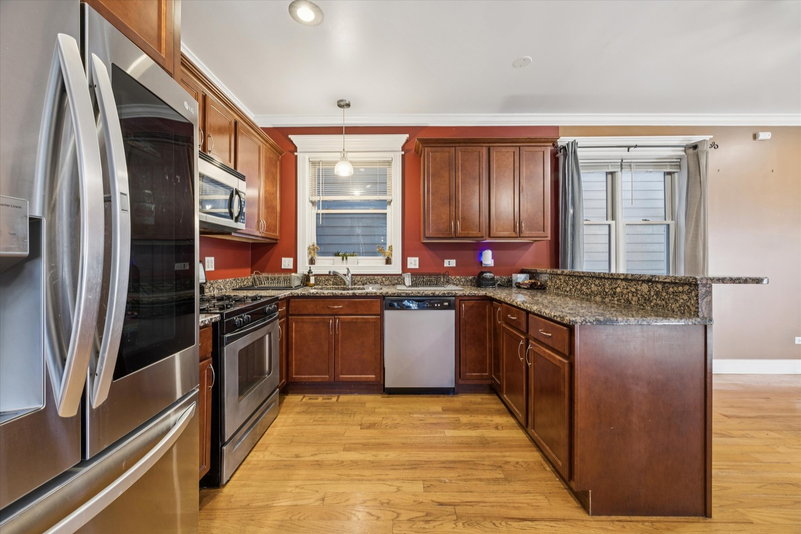 641 East 50th Street, Unit 1 Chicago, IL 60615 - Photo 5 of 15 a kitchen with stainless steel appliances granite countertop a sink stove and refrigerator