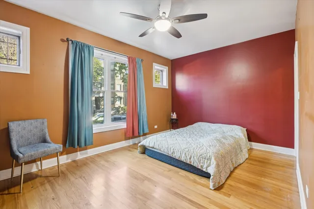 a bedroom with a bed and a chair