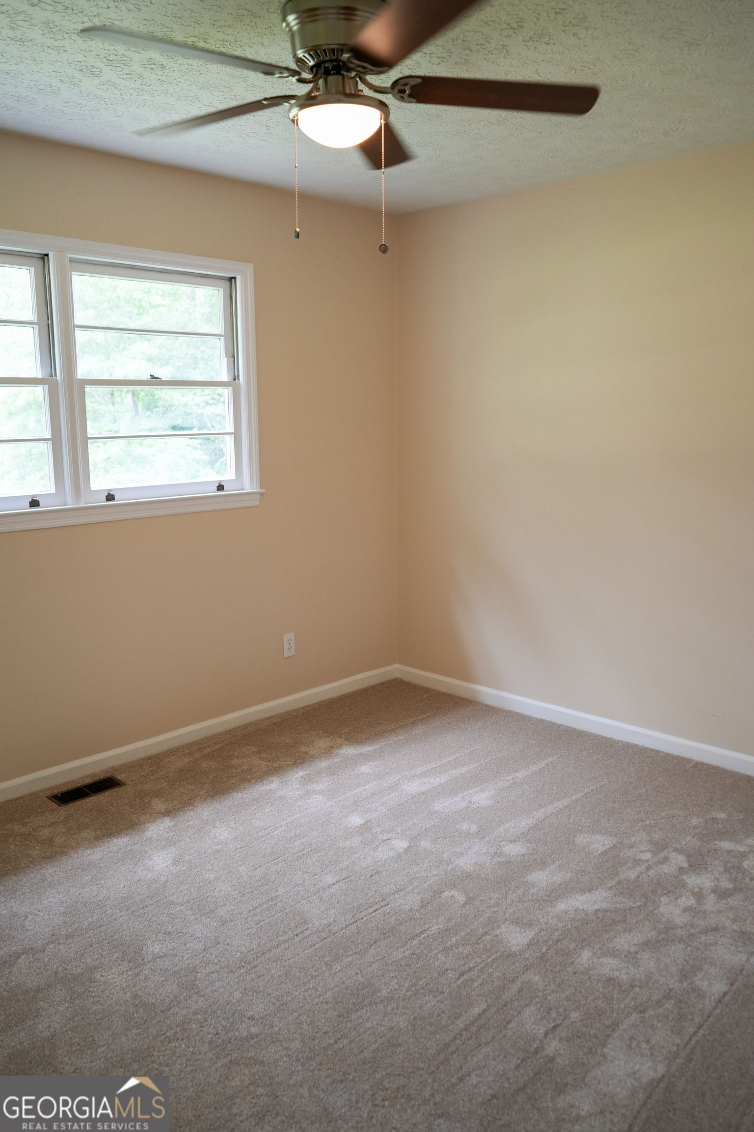 1869 Minter Blue Springs Road Rockledge, GA 30454 - Photo 28 of 45 an empty room with a window