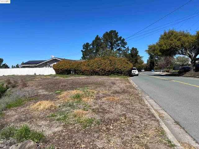 a view of a road with a building in the background