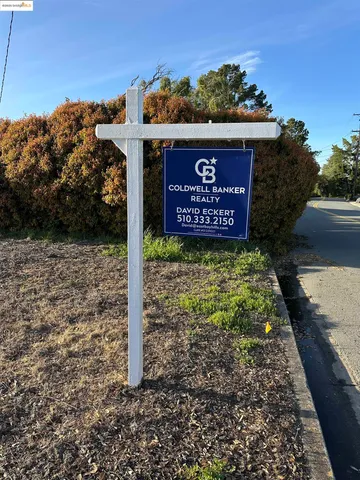 a sign on the side of the road