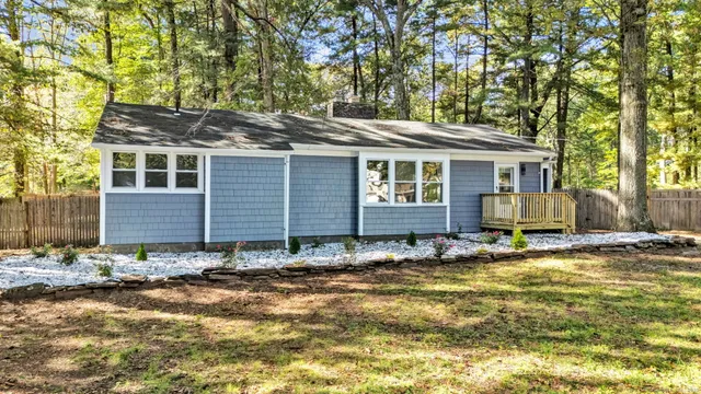 a view of house with yard outdoor space and seating area
