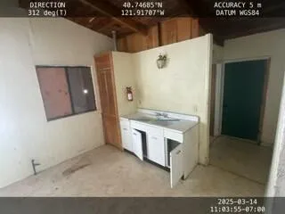 a spacious bathroom with a granite countertop sink a mirror and a bathtub