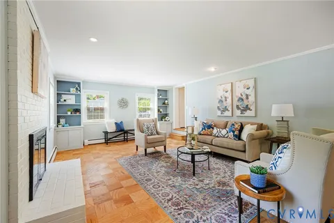 a living room with furniture and a rug