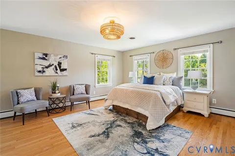 a bedroom with double bed and a window