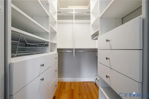 a bedroom with a bed and a table in it