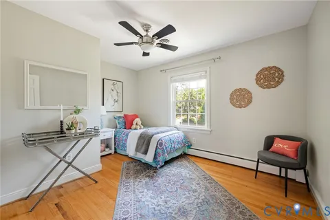 a bedroom with furniture and a window