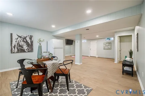 a view of livingroom with hardwood floor and workspace