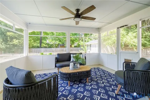 an outdoor space with furniture and umbrella