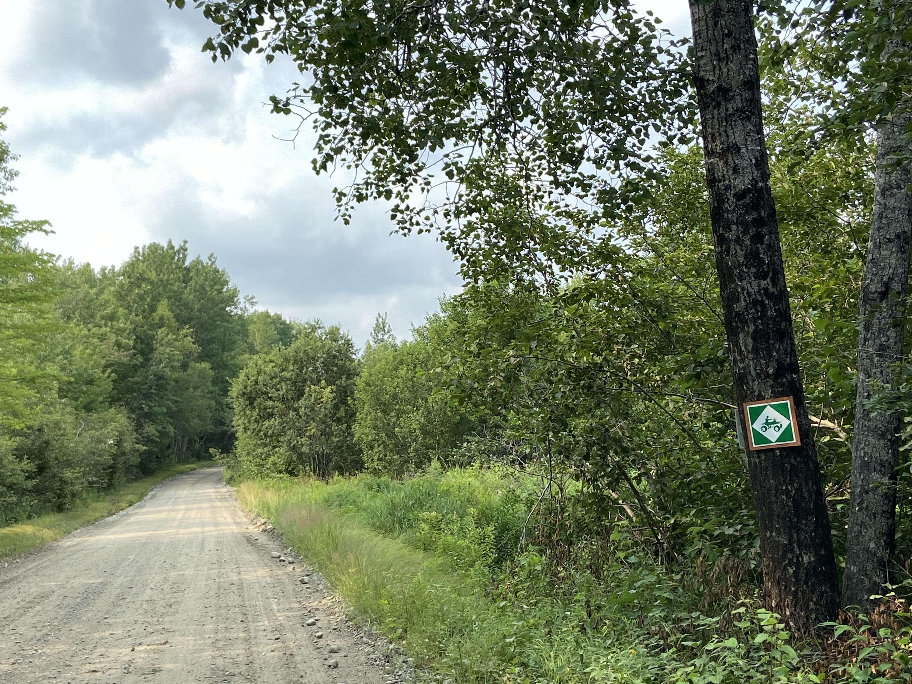 Lot 8 Georgetown Woods Road Columbia Falls, ME 04623 - Photo 2 of 13 Roadside ATV sign