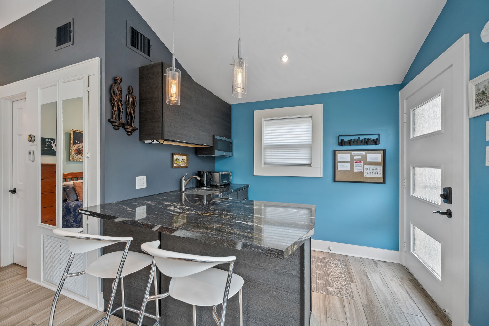 1911 Harold Street Houston, TX 77098 - Photo 23 of 36 The garage apartment kitchenette is thoughtfully designed with modern finishes and a functional layout, making the space ideal for extended stays or independent living.
