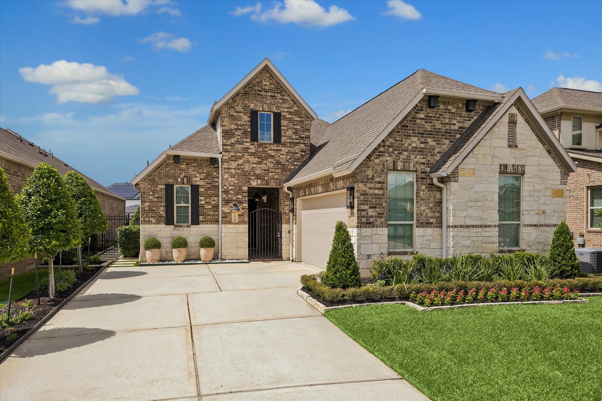 7418 Kearney Hill Lane Spring, TX 77389 - Photo 1 of 35 Nestled within the gates of the Retreat at Augusta Pines, this charming brick and stone single story boasts a welcoming front entry, extended driveway, and meticulous professional landscaping.