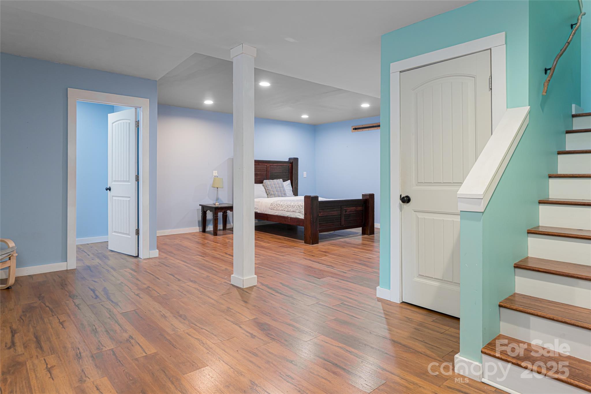 4035 Bald Creek Road Clyde, NC 28721 - Photo 26 of 42 a view of a livingroom with wooden floor and staircase